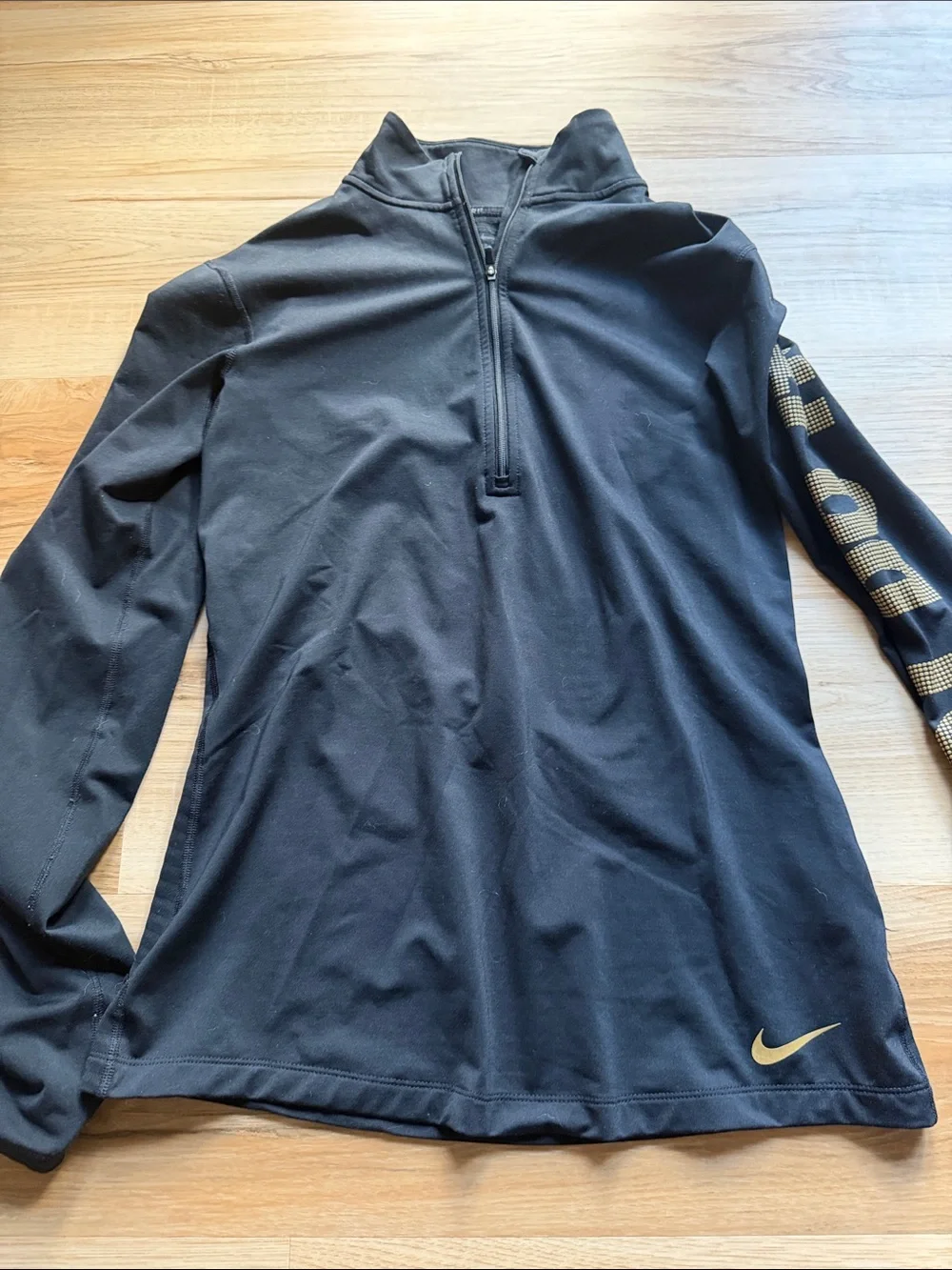 Nike Women’s Black Half-Zip Long-Sleeve Top with Gold Accents